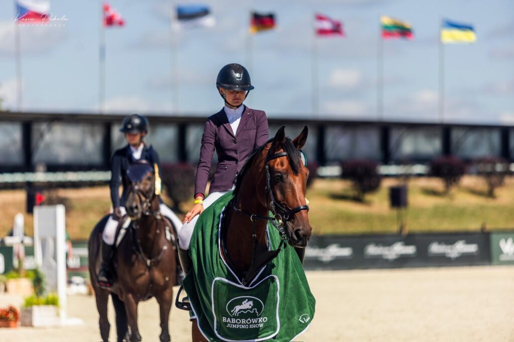 Bay KWPN gelding in a winners rug at an international prize giving in Poland